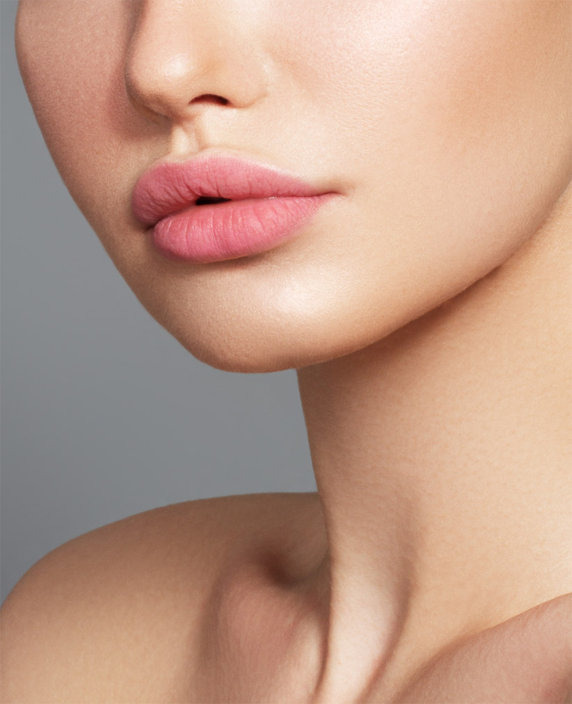 Sexy plump full lips. Close-up face detail. Perfect natural lip makeup. Close up photo with beautiful female face<br />
